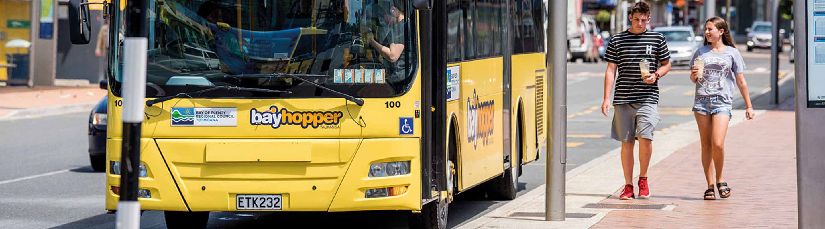 bayhopper bus pulling up to bus stop