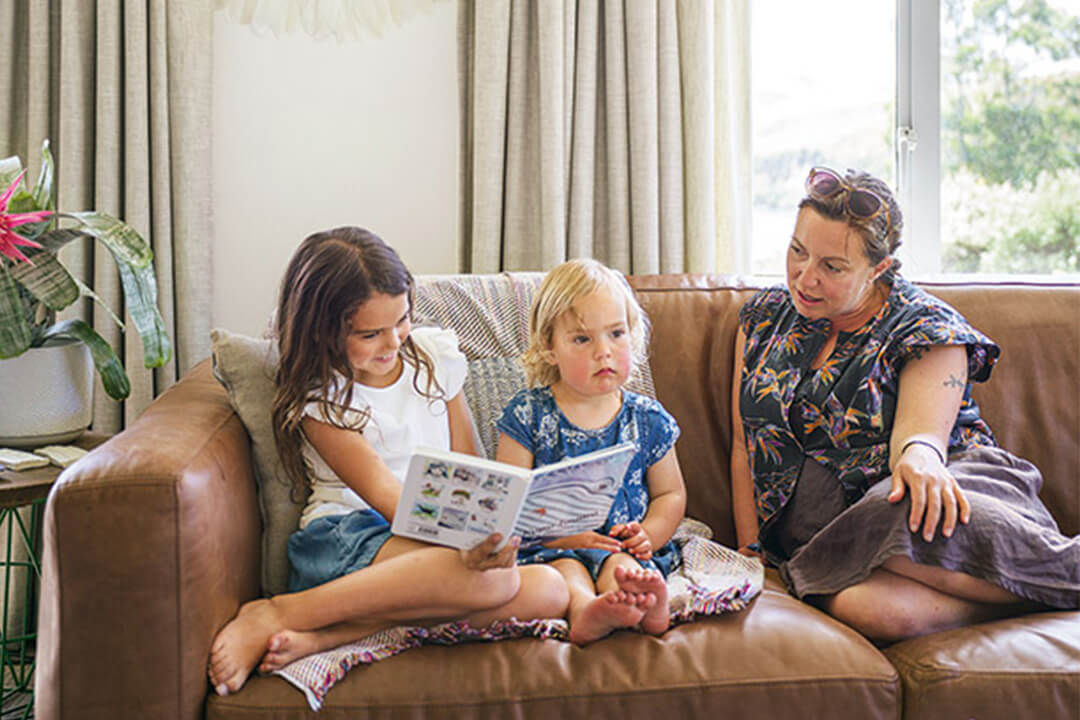 family reading on couch