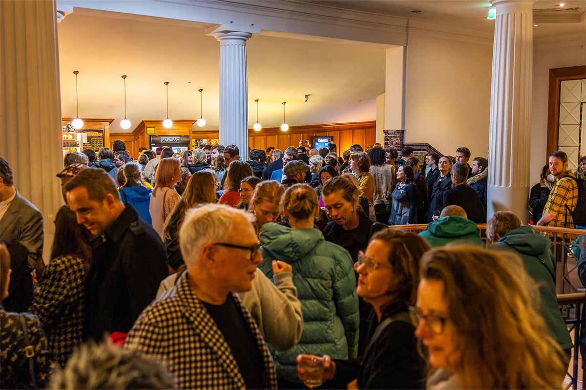 inside the crowded lobby of the embassy theatre